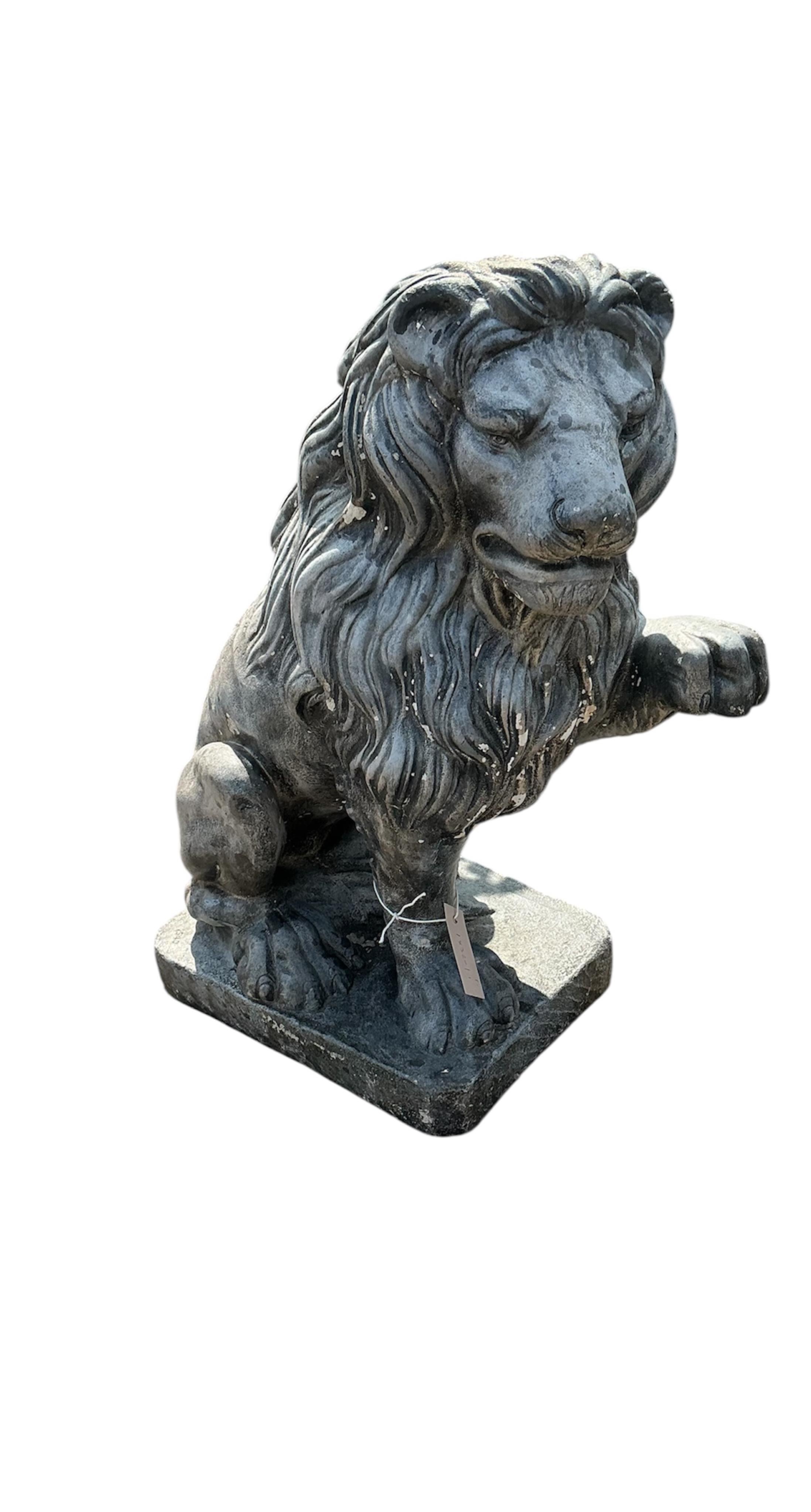 A pair of reconstituted stone, faux lead, lion passant garden ornaments, height 60cm